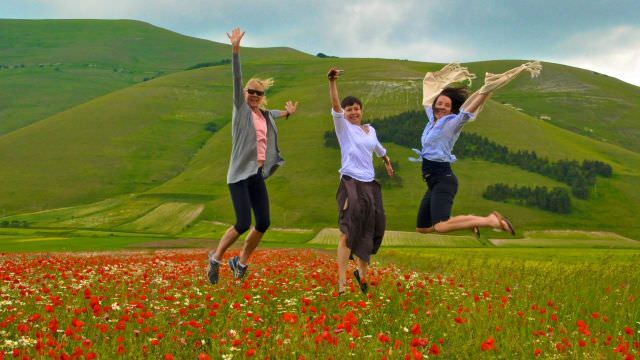 The valley of Castelluccio blooms with poppies in June, creating amazing photo opportunities for our Umbria guests